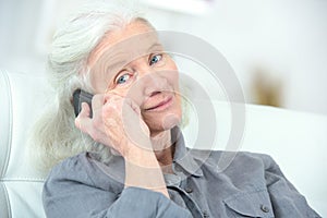 Portrait happy senior woman on phone