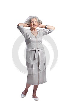 Portrait of happy senior woman wearing light dress