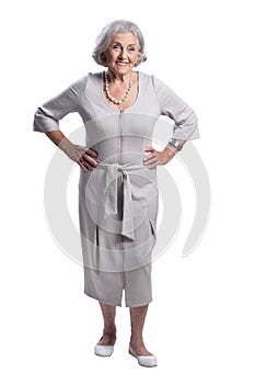 Portrait of happy senior woman wearing light dress