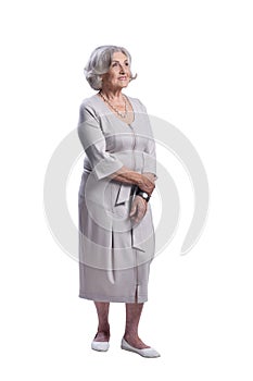 Portrait of happy senior woman wearing light dress