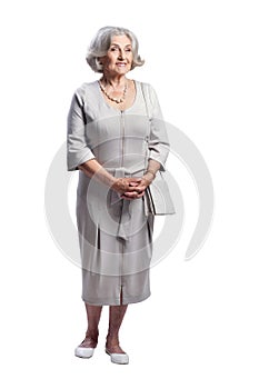 Portrait of happy senior woman wearing light dress