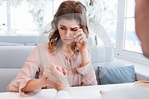 Portrait of happy sensual woman 20s being touched and emotional, after receiving marriage proposal from her man on date in