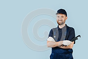 Portrait of a happy service worker with hands crossed, dressed in uniform