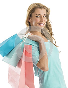 Portrait Of Happy Shopaholic Woman Carrying Shopping Bags photo