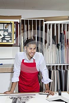 Portrait of a happy skilled worker in workshop