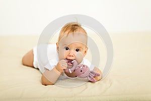 Portrait of happy smile baby relaxing on the bed