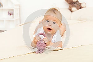 Portrait of happy smile baby relaxing on the bed