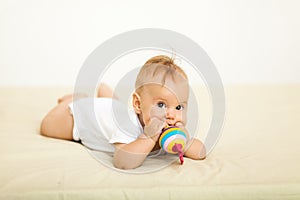 Portrait of happy smile baby relaxing on the bed