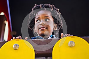 Portrait of happy smile young black kid enjoy the playhood park in outdoor leisure activity - afro american children with ethnich