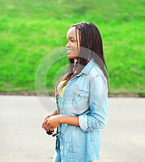 Portrait happy smiling african woman wearing a jeans shirt