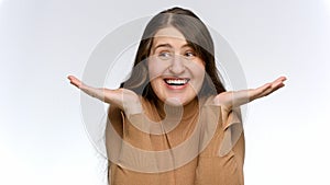 Portrait of happy smiling amazed woman against white studio background