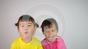 Portrait of a happy smiling Asian child girl isolated on white background.