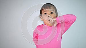 Portrait of a happy smiling Asian child girl isolated on white background.