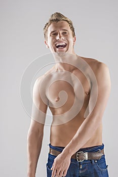 Portrait Of happy Smiling Caucasian Man Posing with Naked Torso