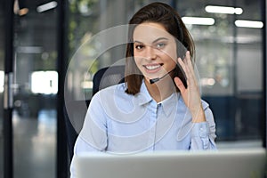 Portrait of happy smiling cheerful support phone operator in headset at office