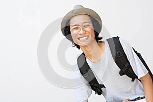 Portrait of Happy smiling college student with book and bag isolated on white background