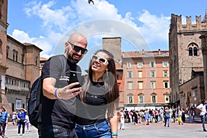 Portrait of happy smiling Couple at Bologna . tourist in Italy Happy Bearded man kissing and hugging on the streets of Italy