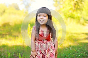 Portrait of happy smiling cute little girl child outdoors