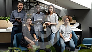 Portrait happy smiling diverse employees team in office