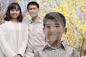 Portrait of happy smiling family in the park in springtime, Beijing, China