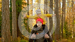 Portrait Happy Smiling Father and Son Sitting on His Father's Shoulders Walking Through Sunny Autumn Yellow Summer