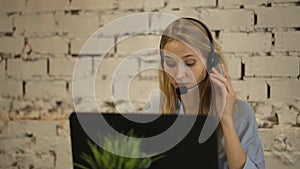 Portrait of happy smiling female customer support phone operator