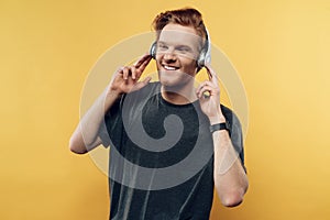 Portrait of Happy Smiling Guy Listening to Music