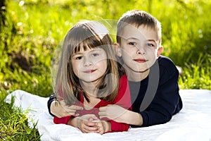 Portrait of happy smiling little children boy and girl on sunny