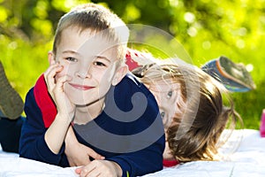 Portrait of happy smiling little children boy and girl on sunny