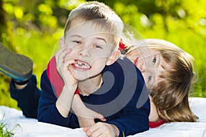 Portrait of happy smiling little children boy and girl on sunny