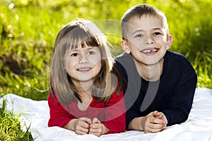 Portrait of happy smiling little children boy and girl on sunny