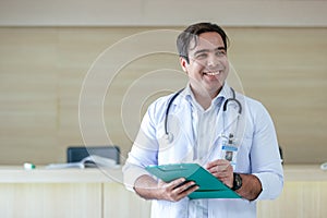 portrait happy smiling male doctor white coat holding folder document.