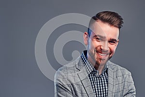 Portrait of happy smiling man in checkered shirt and  gray blaser