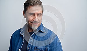 Portrait of happy smiling man with gray hair in casual