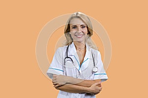 Portrait of happy smiling mature female doctor with folded arms.