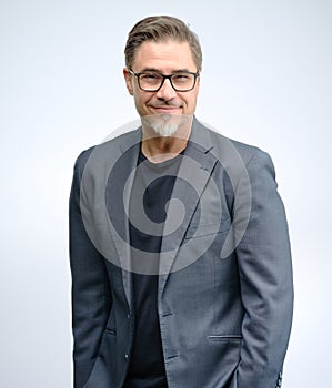 Portrait of happy smiling mid adult businessman