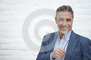 Portrait of happy smiling mid adult businessman on white