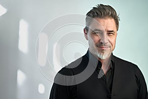 Portrait of happy smiling mid adult businessman on white