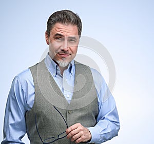 Portrait of happy smiling mid adult businessman on white