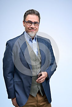 Portrait of happy smiling mid adult businessman on white