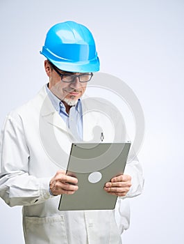 Portrait of happy smiling mid adult engineer on white