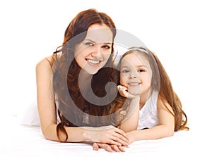 Portrait of happy smiling mother and daughter having fun