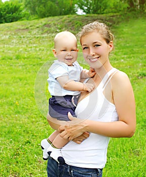Portrait of happy smiling mother and son child outdoors
