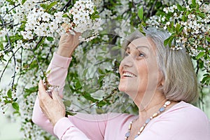 Portrait of happy smiling senior woman outdoors