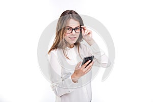 Portrait happy, smiling woman texting on her smart phone, isolated white background. Communication concept. Internet, phone addict