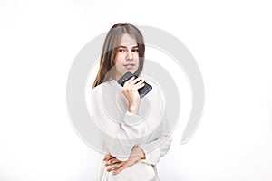 Portrait happy, smiling woman texting on her smart phone, isolated white background. Communication concept. Internet, phone addict