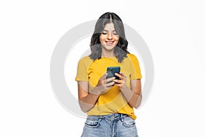 Portrait of happy smiling woman typing sms on smartphone isolated on white background