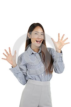 Portrait of happy smiling young beautiful Asian woman with long dark brown hair standing isolated on white background, surprised