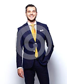 Portrait of happy smiling young businessman, isolated on white