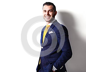 Portrait of happy smiling young businessman, isolated on white